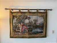 Front view of entire tapestry on wall, rod visible