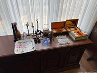 Wide view of entire lot on sideboard