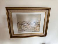 Framed watercolour painting on wall showing full frame