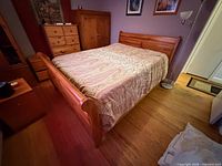 Full view of bed frame with mattress in room