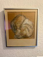 Full view of framed cat sketch under glass