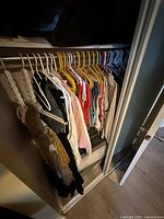Full closet view showing entire grouping of vintage women’s garments on hangers