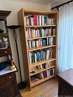 Front view of full-height wooden bookcase