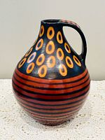 Full side view showing shape, handle, and decorative pattern