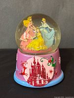 Front view showing princess figurines and base art