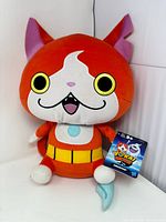 Front view of full Jibanyan plush with tag
