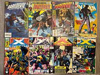 All eight comics laid out front covers visible
