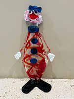 Front view of full clown decanter showing colours and form