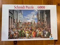 Front of Schmidt Puzzle box showing artwork and 6000 piece count