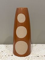 Front view showing full vase and geometric circle design