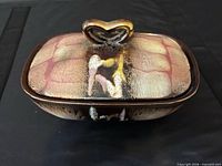 Closed trinket box showing glaze pattern and handle