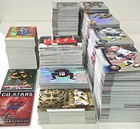 Tall stacks of hockey trading cards viewed from front and side