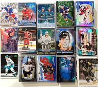 Assorted holographic, parallel and insert Upper Deck hockey cards in sleeves