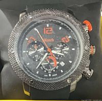 Front view showing dial, bezel, crown and pushers