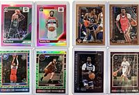 Group shot of all 8 serial-numbered basketball cards in protective cases