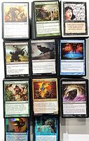 Nine sample cards in sleeves showing set variety and condition