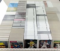 Stacks of baseball cards showing card edges and volume