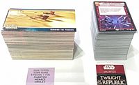 Two stacks of cards: large Topps Episode I stack, smaller Star Wars Unlimited stack with Twilight of the Republic card on front