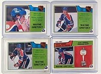 Fronts of all four Gretzky O-Pee-Chee cards in holders