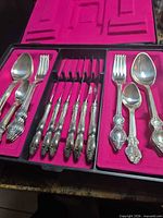 Open case showing full flatware set