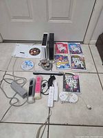 Overview of both consoles, games, controllers and cabling