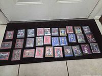 All 28 sleeved cards laid out on black mat