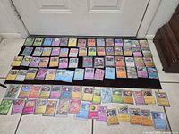 Full layout showing the entire assortment of sleeved holographic Pokémon cards