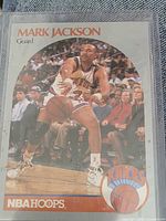 Front of 1990 NBA Hoops Mark Jackson card showing action photo and Knicks logo