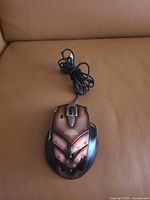 Top view of mouse showing World of Warcraft logo, button layout and discoloration