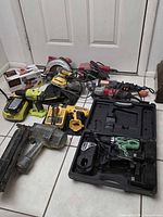 Overview of all power tools laid out on floor