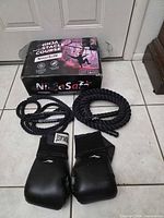 Boxed NinjaSafe obstacle course, two Rhinorope jump ropes, Everlast gloves