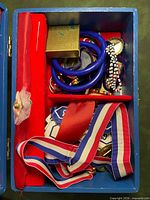 Open box showing interior red lining, ballerina figure and assorted contents