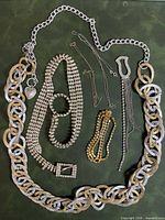 All items in lot laid out on green surface