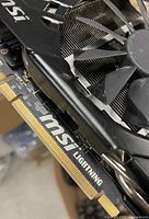 Close view of PCIe connector area showing MSI branding and fan shroud