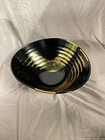 overhead view of black lacquer bowl showing gold Ryu pattern