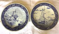 Both Boch Delft chargers front view
