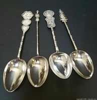 All four silver spoons front view