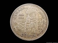 Reverse of 1958 Canada dollar showing totem pole design and legends