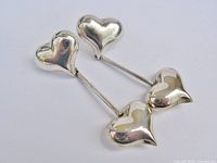 Front view of both sterling silver heart earrings