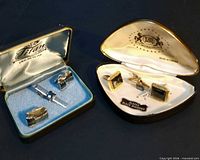 Both open presentation cases showing complete sets