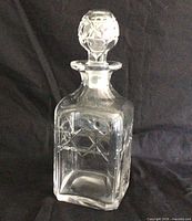 full view of square crystal decanter with stopper