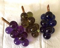 Front view of three grape clusters showing colors and arrangement