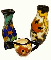 Front view of all three Gouda pottery pieces