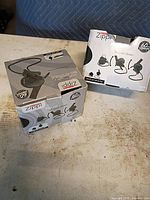 Two boxed Vornado Zippi fans front view