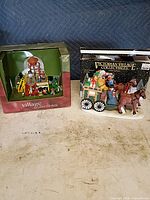 Both boxed porcelain pieces side by side