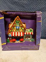 Front view of lighted flower shop in original box