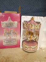 carousel and original box front view