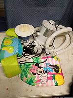 Pump, dispenser, swim vest and kickboard grouped