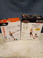 Front view of both boxed fitness sets