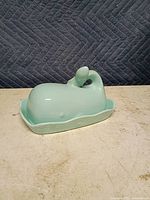 Whale-shaped lid on tray, side view